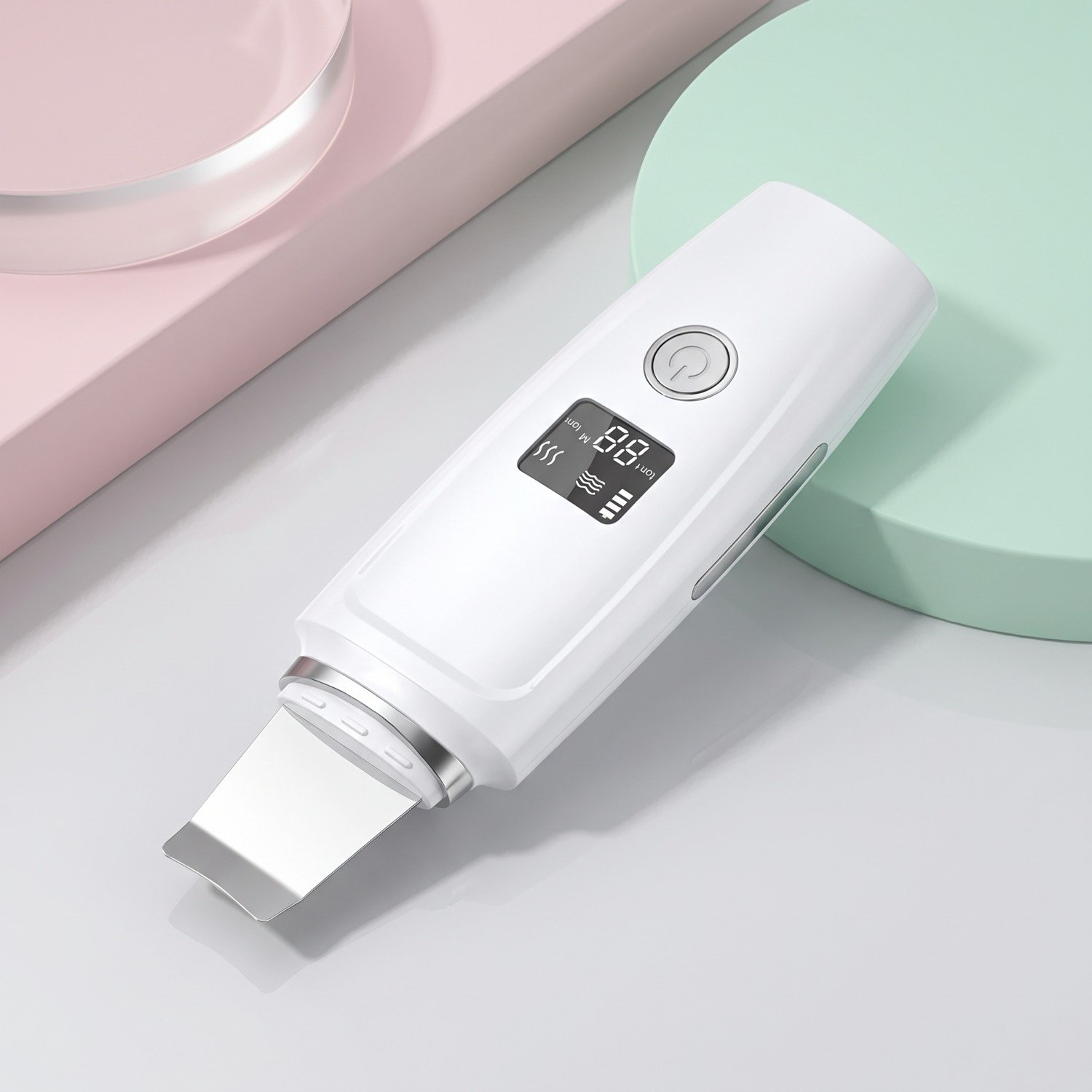 UltraPore ultrasonic skin scrubber resting on a pastel pink and mint set